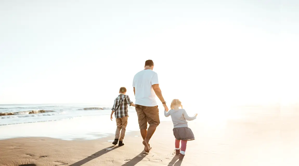 happiness father running on the beach with kids